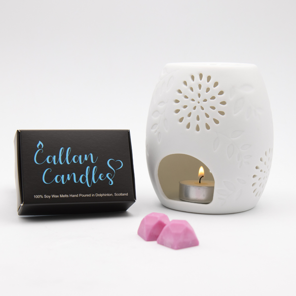 white round ceramic soy wax melter and a box of callan candles gemstone soy wax melts